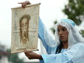 Picture: Female presence: Rachel Thomas, playing the role of Veronica, displaying the facial imprint of Christ to the procession crowd
