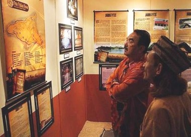 Image: Unique: Ana Faqir (right) relating stories to Mohd Ali (left) at the launch of the History and Mystery of Pulau Besar exhibition on Sunday.